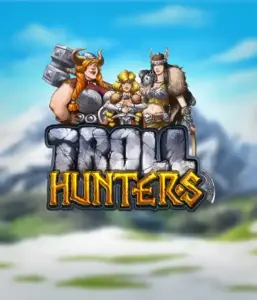 Графика игрового автомата "Troll Hunters" от Play'N Go, где изображены три воина-викинга: две женщины и один мужчина, одетые в традиционные викингские доспехи. На фоне виднеются заснеженные горы, что добавляет атмосферу скандинавской мифологии. Этот игровой автомат идеален для поклонников викингских саг и поисков приключений.